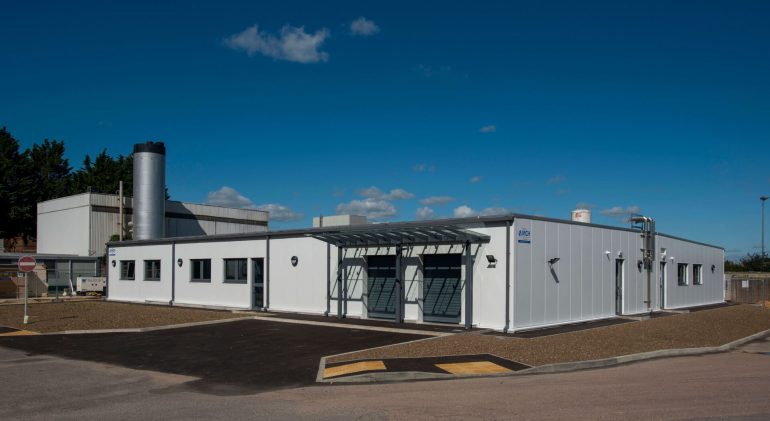 A modular set of medical buildings outside, on a sunny day.